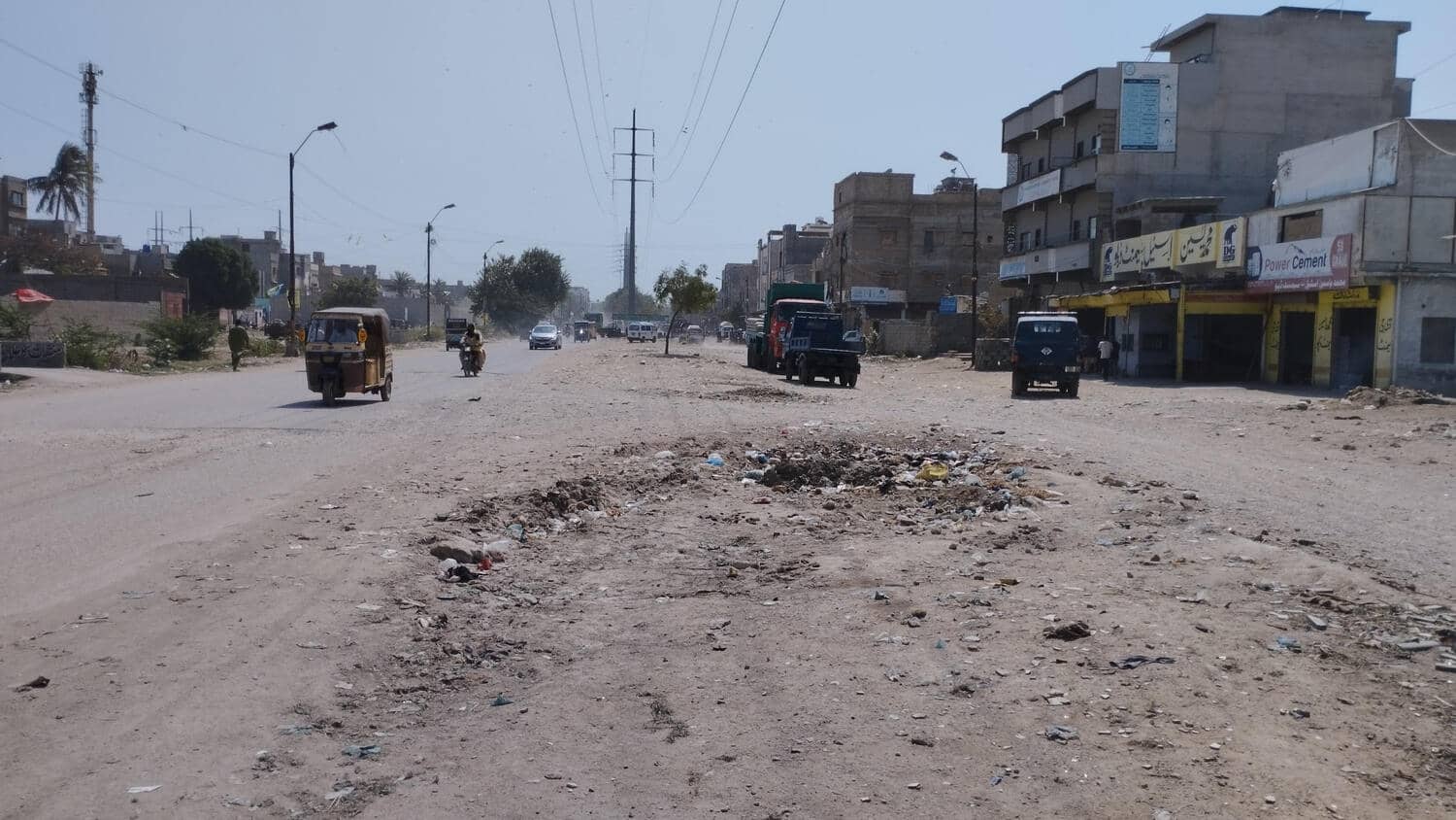 Existing condition — the carriageway on Road 13000, with the asphalt removed and the subgrade exposed. Road 13000 Rehabilitation and Flyover, Korangi, Korangi, Karachi
