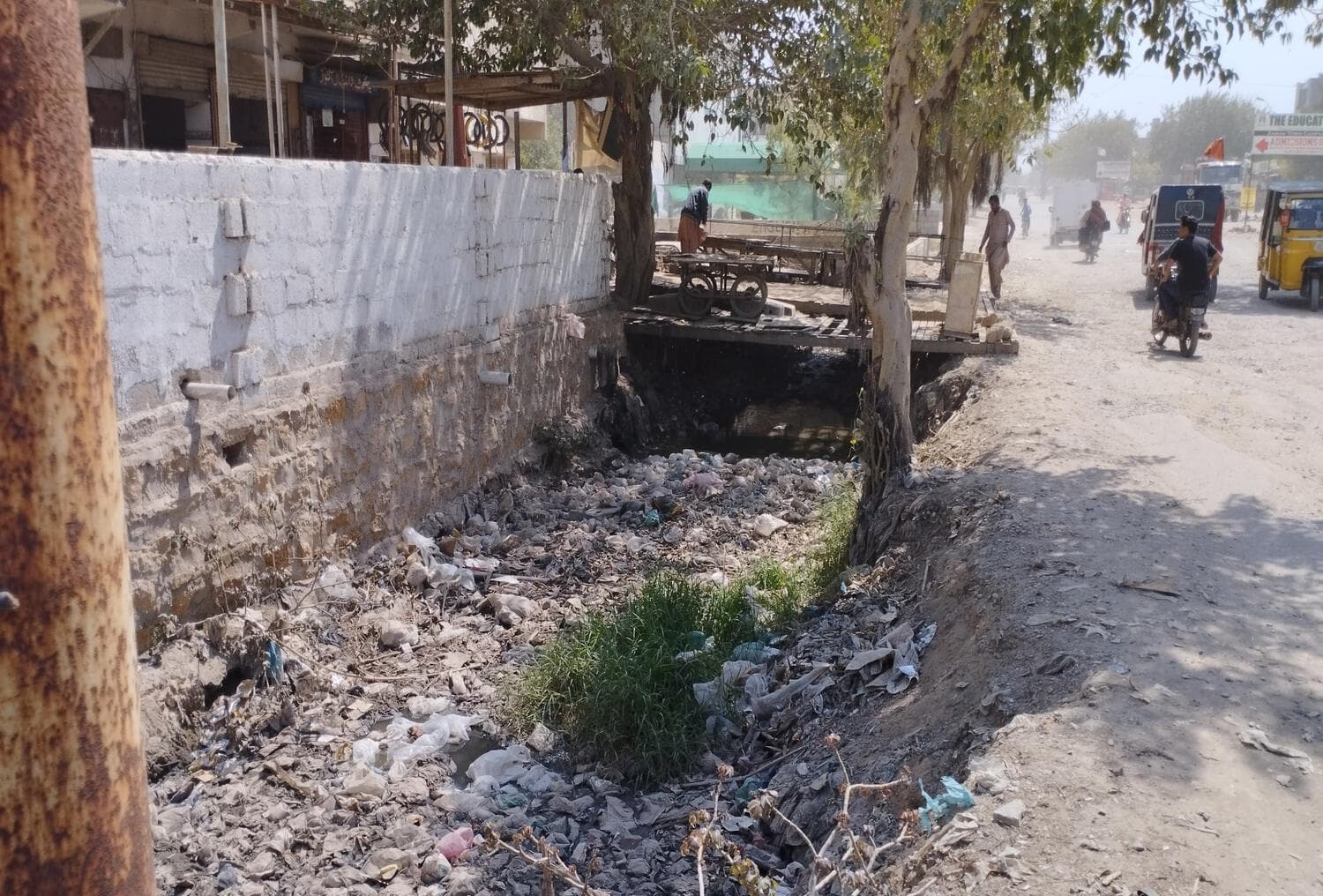 Existing condition — the roadside drain, choked and unprotected. Road 13000 Rehabilitation and Flyover, Korangi, Korangi, Karachi